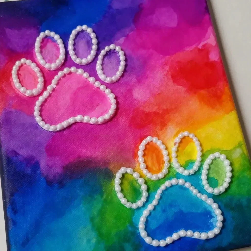 Colorful Rainbow Puppy Paw Raised-Salt Painting showcasing artistic salt texture.